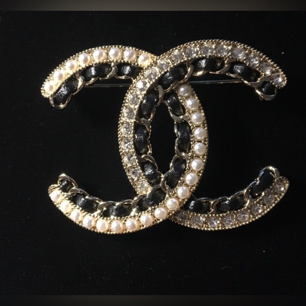 Designer-inspired Pearl/crystal ,leather-laced brooch. Perfect for a lapel. NWT